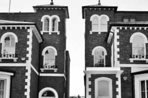 two estate buildings in black and white
